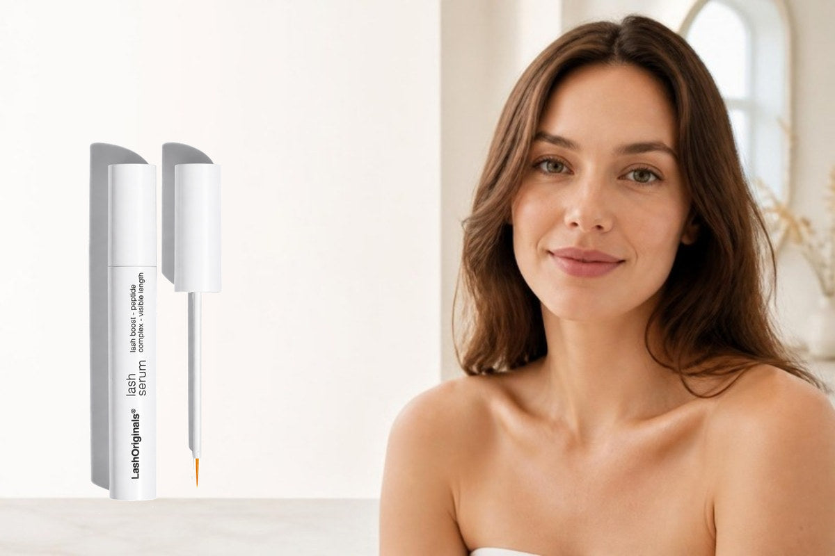 Adult woman in a bright neutral beauty setting beside Lash Originals Lash Serum and its fine-tip applicator.